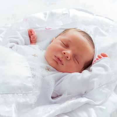 What is the best sleeping position to prevent reflux in newborn babies?